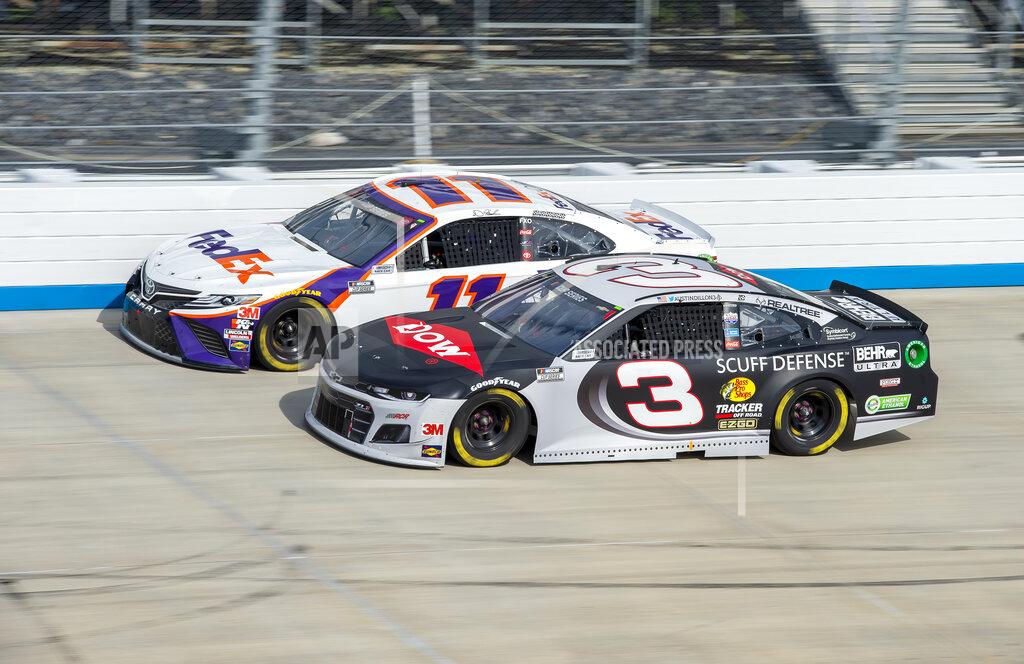 Jason Minto Denny Hamlin (11) passes Austin Dillon (3) for the lead during a NASCAR Cup Series auto race at Dover International Speedway, Saturday, Aug. 22, 2020, in Dover, Del. (AP Photo/Jason Minto)