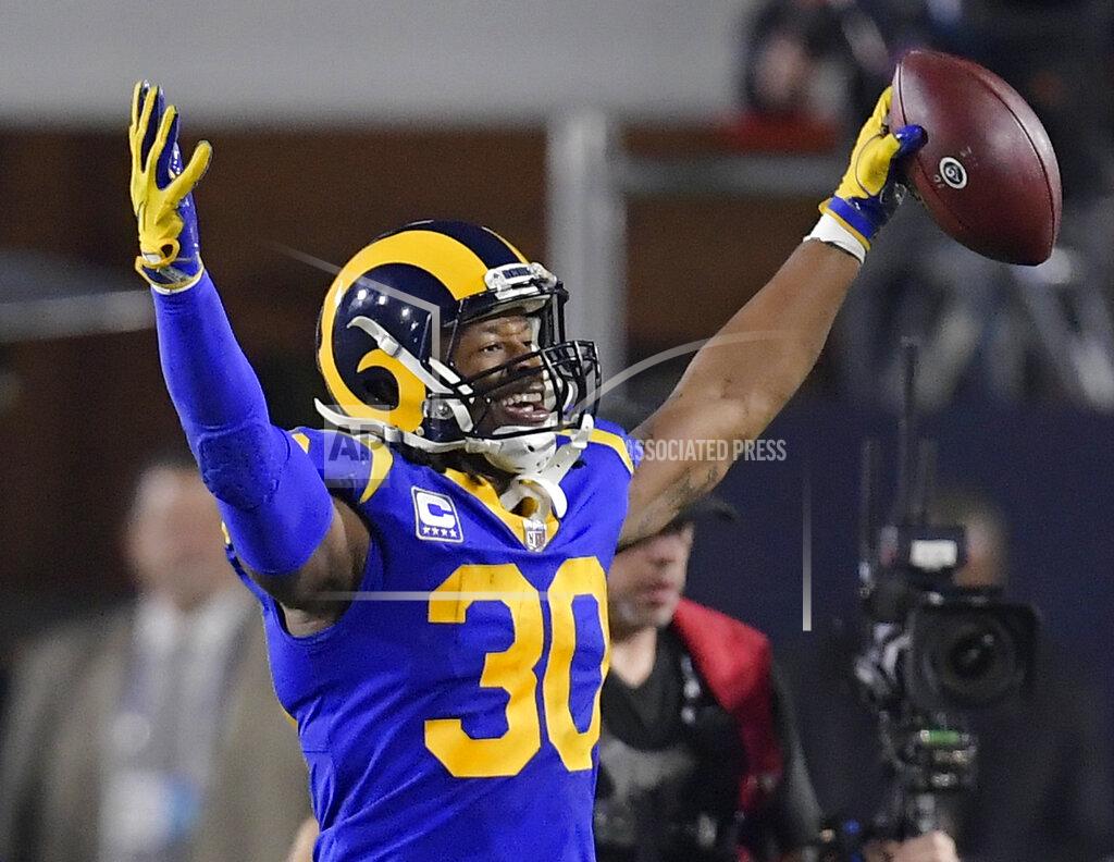 Mark J. Terrill FILE - In this Saturday, Jan. 12, 2019, file photo, Los Angeles Rams running back Todd Gurley celebrates after scoring against the Dallas Cowboys during the first half in an NFL divisional football playoff game in Los Angeles. Gurley loved to attend the Super Bowl as a fan the past few years. Now that he finally gets to play in it with the Rams, the star running back doesn't even care if he's sharing carries with C.J. Anderson. (AP Photo/Mark J. Terrill, File)