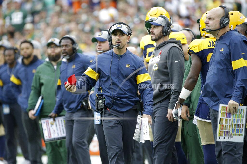 Mike Roemer Green Bay Packers head coach Matt LaFleur considers throwing a challenge flag during the second half of an NFL football game against the Denver Broncos, Sunday, Sept. 22, 2019, in Green Bay, Wis. (AP Photo/Mike Roemer)