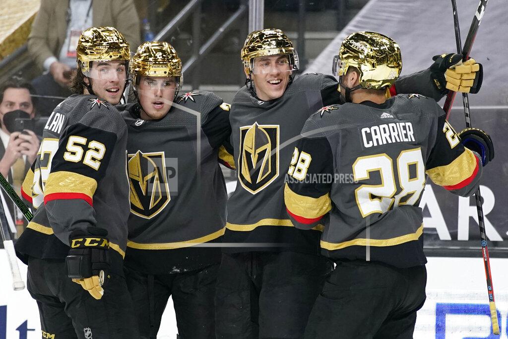 John Locher Vegas Golden Knights celebrate after left wing Tomas Nosek, second from right, scored against the Los Angeles Kings during the second period of an NHL hockey game Monday, March 29, 2021, in Las Vegas. (AP Photo/John Locher)