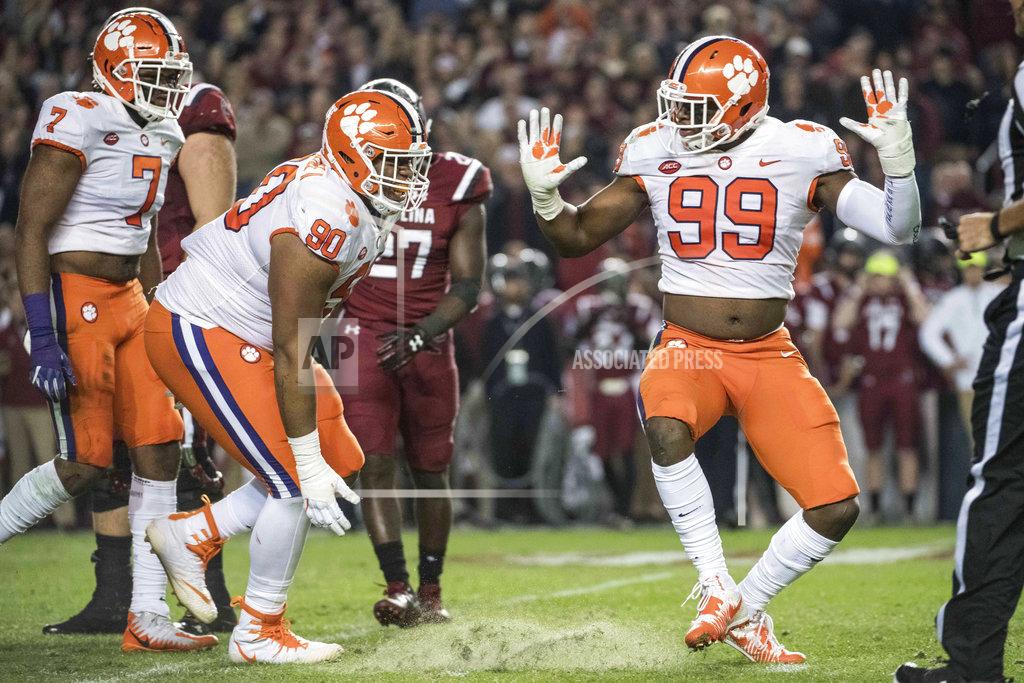 Sean Rayford FILE - In this Nov. 25, 2017, file photo, Clemson defensive end Clelin Ferrell (99) and Dexter Lawrence (90) celebrate a sack during the first half of an NCAA college football game against South Carolina, in Columbia, S.C. Ferrell says the 2018 Tigers "haven't done anything" when asked whether there's a gap between Clemson and the rest of the Atlantic Coast Conference as the Tigers chase a fourth straight league title. (AP Photo/Sean Rayford, File)
