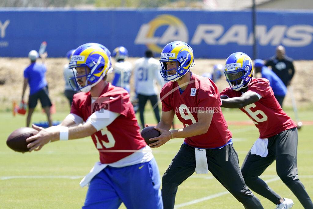 Marcio Jose Sanchez Los Angeles Rams quarterbacks John Wolford, left, Matthew Stafford (9) and Bryce Perkins, right, participate in drills at the NFL football team's practice facility Monday, May 23, 2022, in Thousand Oaks, Calif. (AP Photo/Marcio Jose Sanchez)