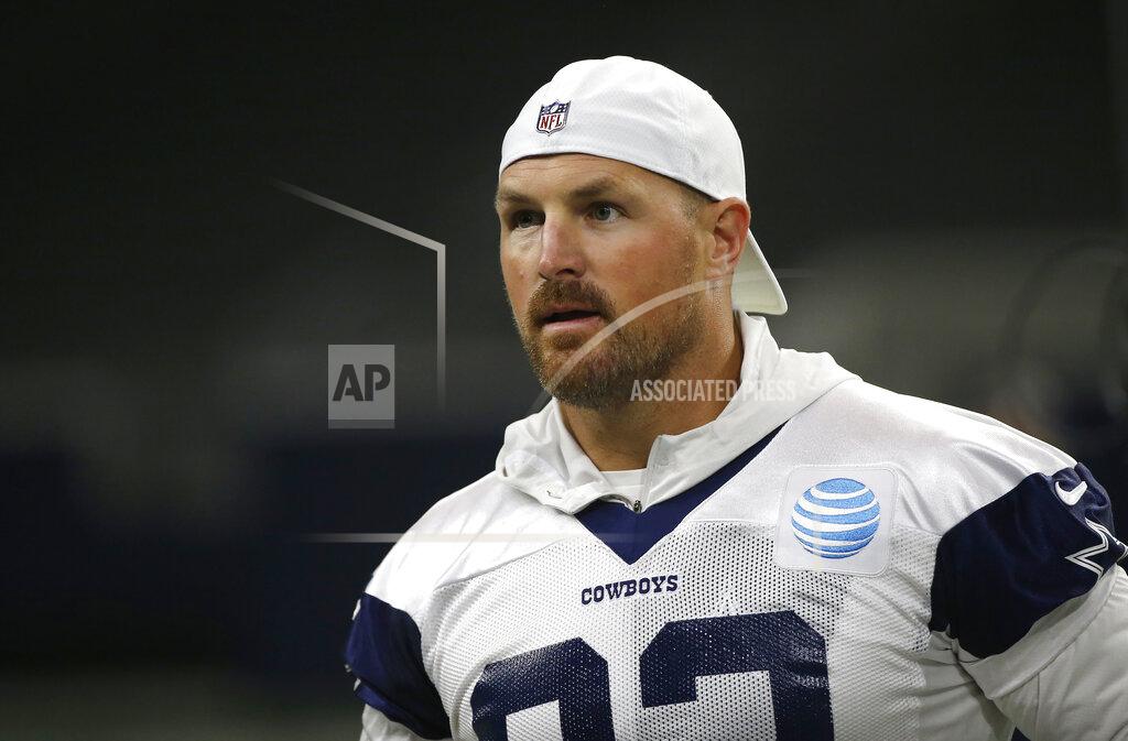 In this May 29, 2019, photo, Dallas Cowboys tight end Jason Witten (82) stands on the field during an organized team activity at its NFL football training facility in Frisco, Texas. Witten talks a lot about blending in now that he's back for what will be a club-record 16th season with the Dallas Cowboys following a year in retirement. (AP Photo/Ron Jenkins)