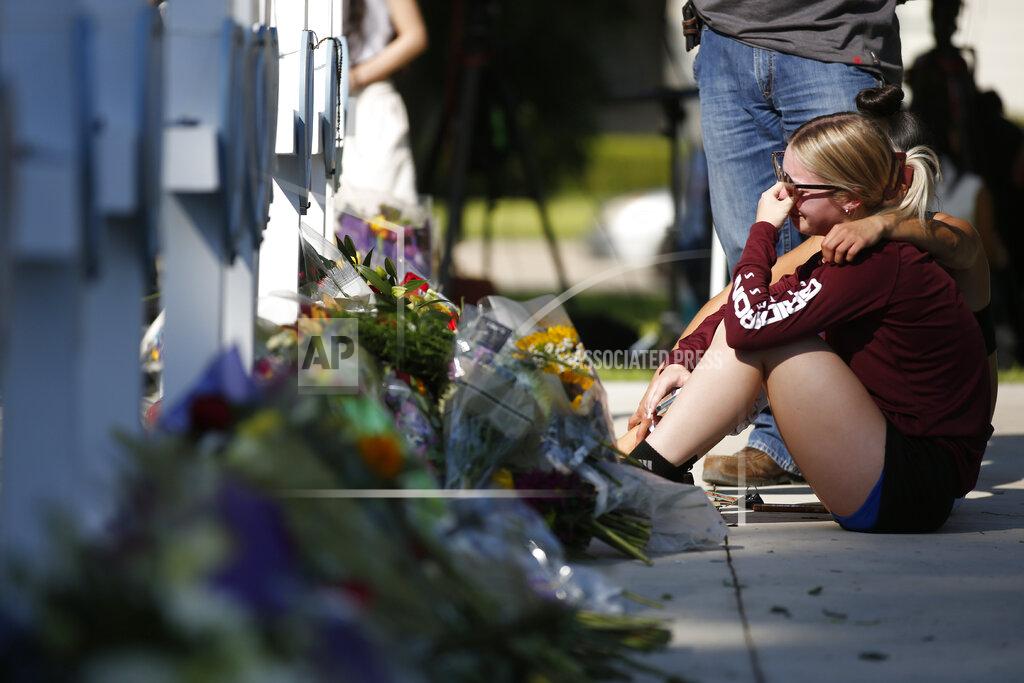 Dario Lopez-Mills A woman reacts as she pays her respects at a memorial site for the victims killed in this week's elementary school shooting in Uvalde, Texas, Thursday, May 26, 2022. (AP Photo/Dario Lopez-Mills)