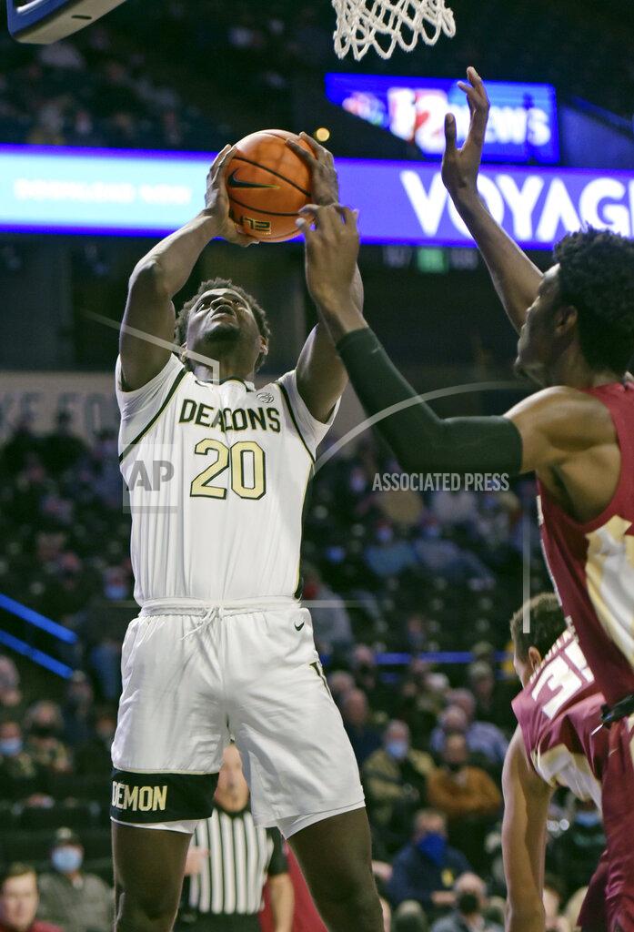 Walt Unks Wake Forest's Khadim Sy is fouled as he sinks a basket in the first half of an NCAA college basketball game against Florida State, Tuesday, Jan. 4, 2022 at Joel Coliseum in Winston-Salem, N.C. (Walt Unks/The Winston-Salem Journal via AP)