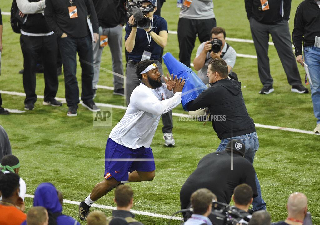 Richard Shiro Clemson's Dexter Lawrence,left, runs drills during NFL Pro Day Thursday, March 14, 2019, in Clemson, S.C. (AP Photo/Richard Shiro)