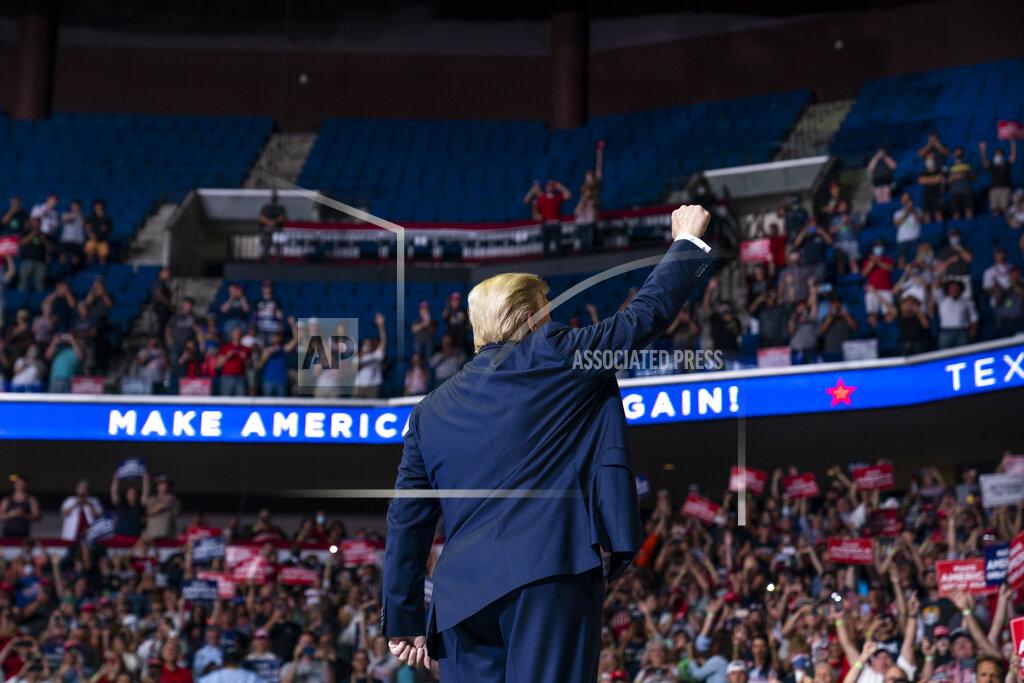 Evan Vucci President Donald Trump arrives on stage to speak at a campaign rally at the BOK Center, Saturday, June 20, 2020, in Tulsa, Okla. (AP Photo/Evan Vucci)