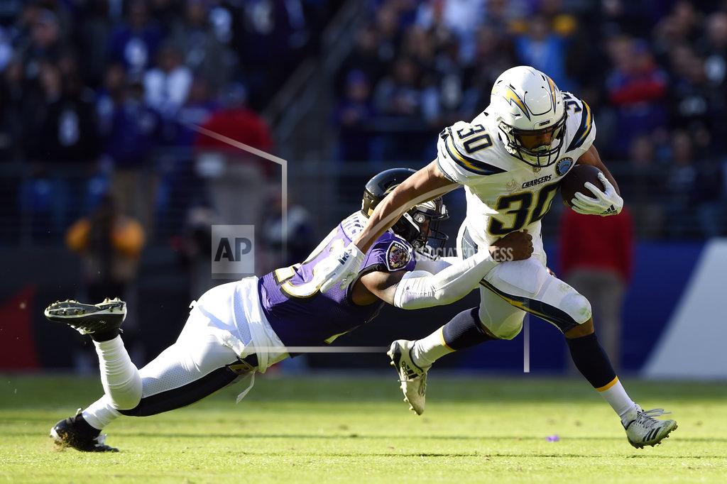 Gail Burton Los Angeles Chargers running back Austin Ekeler rushes the ball against Baltimore Ravens strong safety Tony Jefferson in the first half of an NFL wild card playoff football game, Sunday, Jan. 6, 2019, in Baltimore. (AP Photo/Gail Burton)