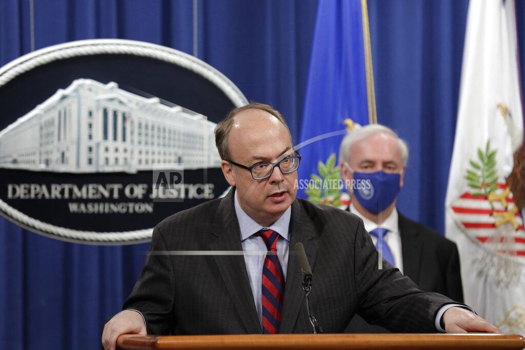 Yuri Gripas Acting Assistant U.S. Attorney General Jeffrey Clark speaks as he stands next to Deputy Attorney General Jeffrey A. Rosen during a news conference to announce the results of the global resolution of criminal and civil investigations with an opioid manufacturer at the Justice Department in Washington, Wednesday, Oct. 21, 2020. (Yuri Gripas/Pool via AP)