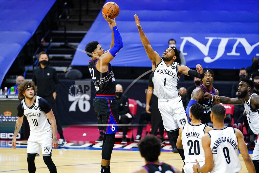 Matt Slocum Philadelphia 76ers' Tobias Harris (12) goes up for a shot against Brooklyn Nets' Bruce Brown (1) during the second half of an NBA basketball game, Saturday, Feb. 6, 2021, in Philadelphia. (AP Photo/Matt Slocum)
