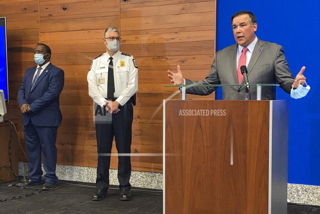 Andrew Welsh Huggins FILE - In this April 21, 2021 file photo, Columbus Mayor Andrew Ginther, right, speaks during a news conference in Columbus, Ohio. The announcement that the U.S. Justice Department will provide technical assistance to Columbus police — at the city's invitation — has done little to curb community activists’ allegations that officials aren't doing enough to change the department following a series of fatal police shootings of Black people. On Thursday, Sept. 16, 2021 the activists asked the Justice Department to launch an investigation through its Civil Rights Division, a probe sometimes called a “pattern-or-practice” investigation that can lead to court-ordered oversight of a troubled police department. (AP Photo/Andrew Welsh-Huggins, File)
