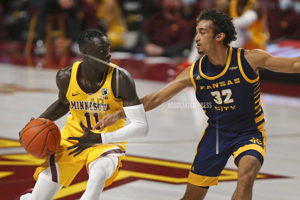 Stacy Bengs Minnesota guard Both Gach (11) controls the ball against UMKC guard Kaimen Lennox (32) during an NCAA college basketball game Thursday, Dec. 10, 2020, in Minneapolis. (AP Photo/Stacy Bengs)