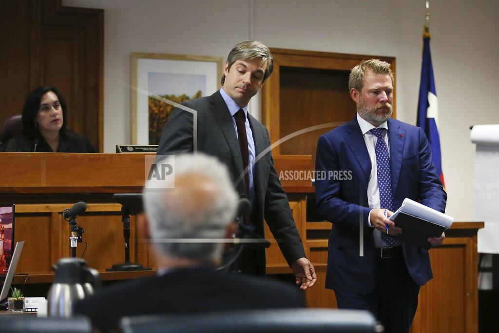 Briana Sanchez Andino Reynal, left, and Wesley Ball, right, speak to the judge during closing arguments Friday, Aug. 5, 2022, at the Travis County Courthouse in Austin, Texas. Jurors were asked to assess punitive damages against InfoWars host Alex Jones after awarding $4.1 million in actual damages to the parents of Jesse Lewis on Thursday. (Briana Sanchez/Austin American-Statesman via AP, Pool)