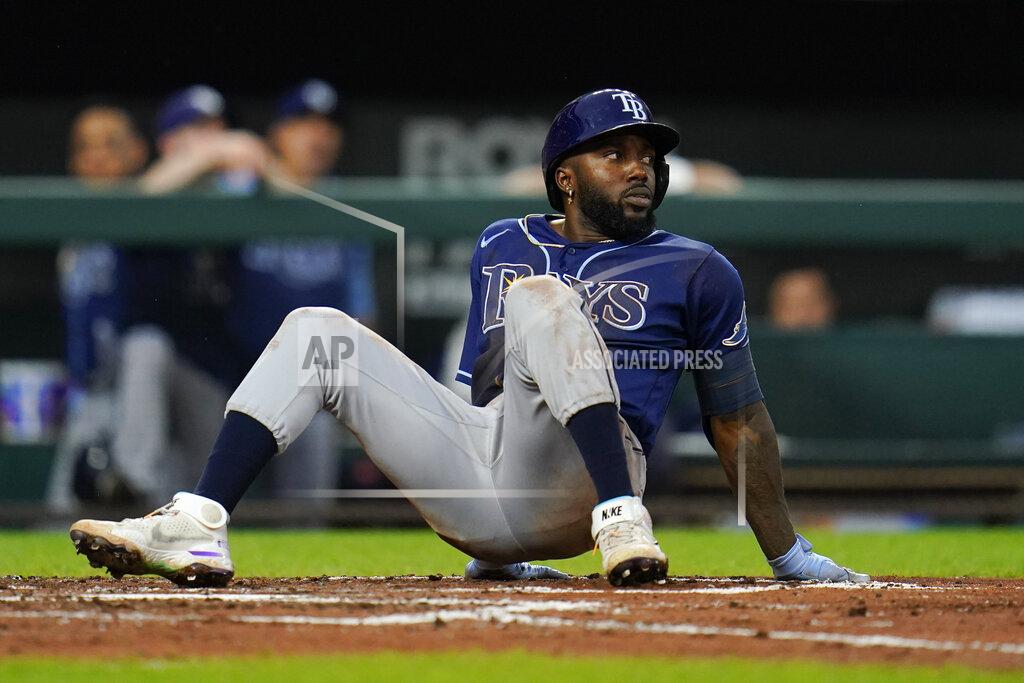 Julio Cortez Tampa Bay Rays' Randy Arozarena looks toward the mound after loosing his footing while ducking out of the way of a high pitch from Baltimore Orioles starting pitcher Spenser Watkins during the third inning of a baseball game, Tuesday, July 26, 2022, in Baltimore. (AP Photo/Julio Cortez)