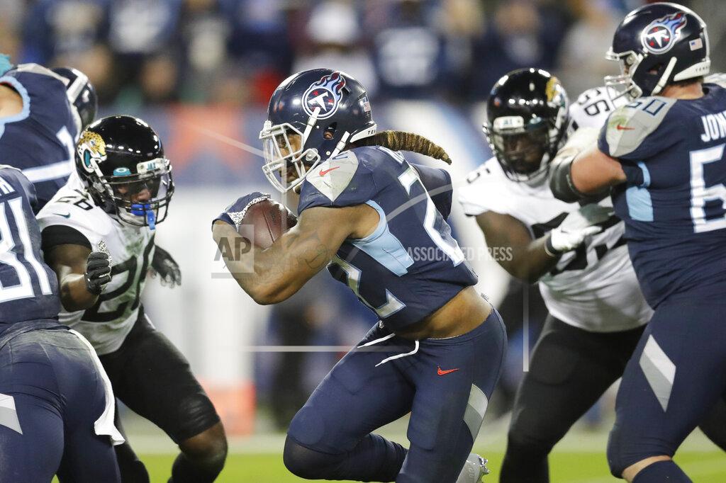 James Kenney Tennessee Titans running back Derrick Henry (22) runs for a 7-yard touchdown against the Jacksonville Jaguars in the second half of an NFL football game Sunday, Nov. 24, 2019, in Nashville, Tenn. (AP Photo/James Kenney)