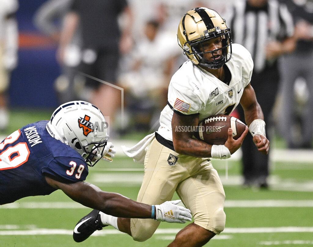 Darren Abate Army quarterback Jabari Laws, right, evades UTSA's Rashad Wisdom during the first half of an NCAA college football game Saturday, Sept. 14, 2019, in San Antonio. (AP Photo/Darren Abate)