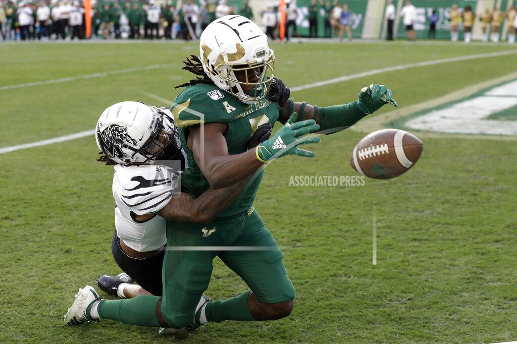 Chris O'meara South Florida wide receiver Randall St. Felix (5) can't make the catch as he is taken down by Memphis defensive back T.J. Carter during the first half of an NCAA college football game Saturday, Nov. 23, 2019, in Tampa, Fla. (AP Photo/Chris O'Meara)