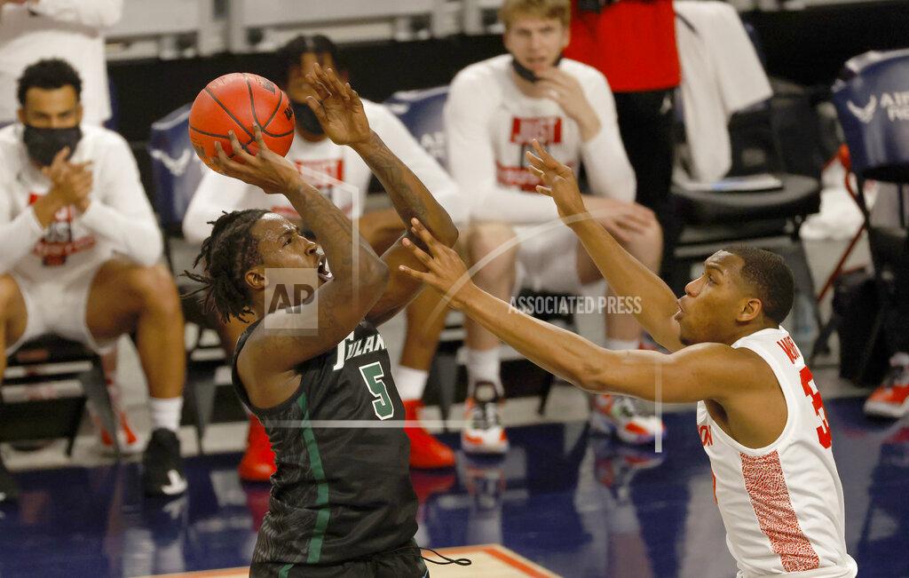 Ron Jenkins Tulane forward Kevin Cross (5) goes up to shoot as Houston forward Fabian White Jr. (35) defends during the first half of an NCAA college basketball game in the quarterfinal round of the American Athletic Conference men's tournament Friday, March 12, 2021, in Fort Worth, Texas. (AP Photo/Ron Jenkins)
