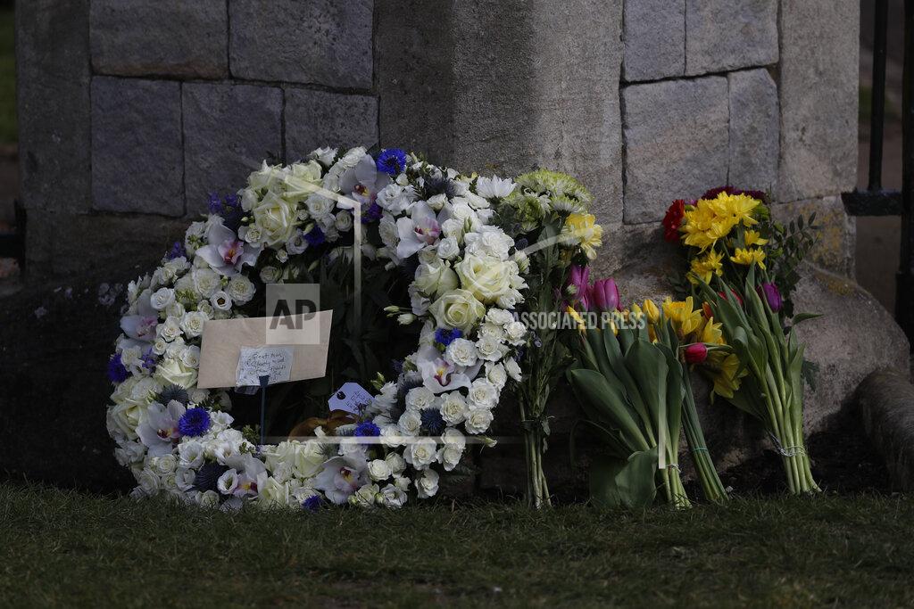 Alastair Grant A wreath laid by Andre and Stan Walker for Prince Philip outside Windsor Castle in Windsor, England, Friday, April 16, 2021. Prince Philip husband of Britain's Queen Elizabeth II died April 9, aged 99, his funeral will take place Saturday at Windsor Castle in St George's Chapel. (AP Photo/Alastair Grant)