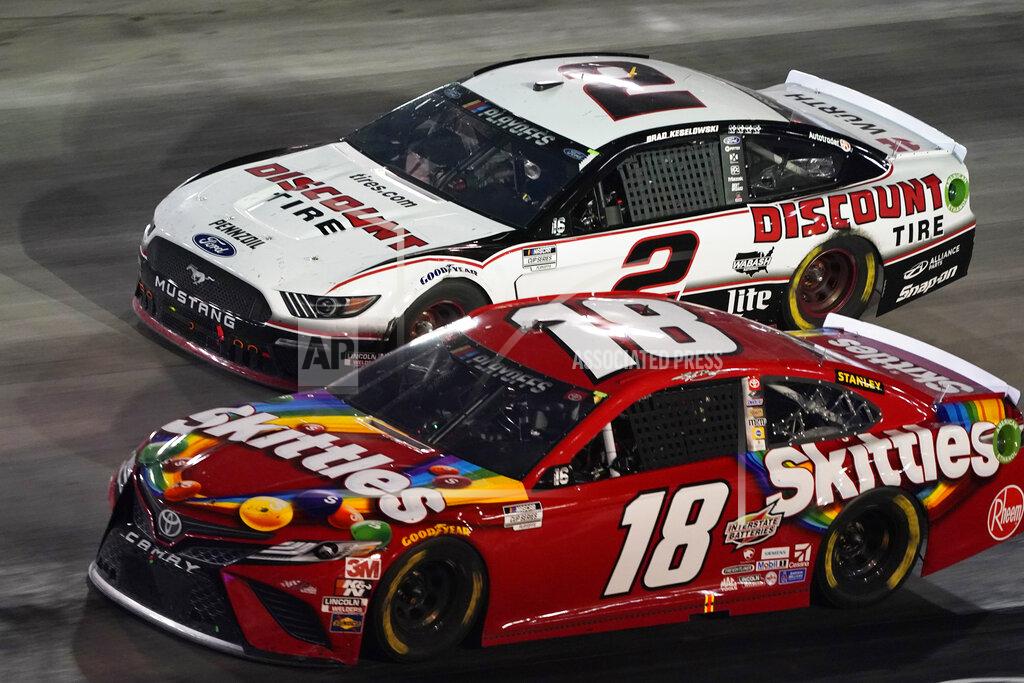 Steve Helber Kyle Busch (18) and Brad Keselowski (2) drive out of Turn 4 during the NASCAR Cup Series auto race Saturday, Sept. 19, 2020, in Bristol, Tenn. (AP Photo/Steve Helber)