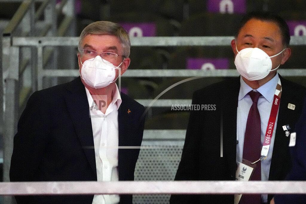 Kiichiro Sato International Olympic Committee's President Thomas Bach, left, visits wheelchair fencing at the Tokyo 2020 Paralympic Games, Wednesday, Aug. 25, 2021, in Chiba, Japan. (AP Photo/Kiichiro Sato)