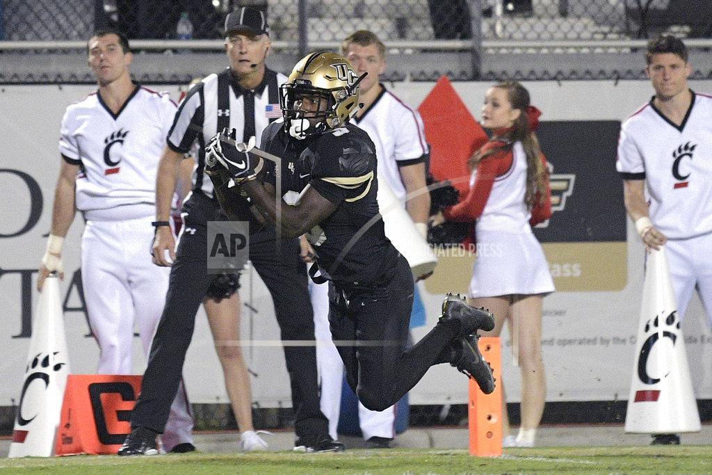 Phelan M. Ebenhack Central Florida running back Adrian Killins Jr. (9) catches a pass in the end zone for a 17-yard touchdown during the first half of an NCAA college football game against Cincinnati Saturday, Nov. 17, 2018, in Orlando, Fla. (AP Photo/Phelan M. Ebenhack)