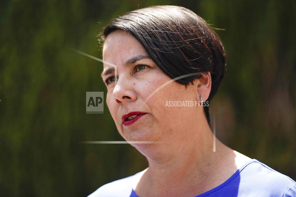 Ashley Landis Johnna Gherardini, executive director of South Coast Medical Group, speaks to reporters outside her office building, where Dr. John Cheng worked, on Tuesday, May 17, 2022, in Aliso Viejo, Calif. Cheng, 52, was killed in Sunday's shooting at Geneva Presbyterian Church. (AP Photo/Ashley Landis)
