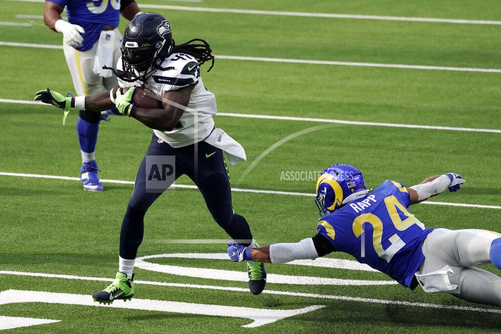 Jae C. Hong Seattle Seahawks running back Alex Collins, right, runs for a touchdown past Los Angeles Rams safety Taylor Rapp (24) during the first half of an NFL football game Sunday, Nov. 15, 2020, in Inglewood, Calif. (AP Photo/Jae C. Hong)