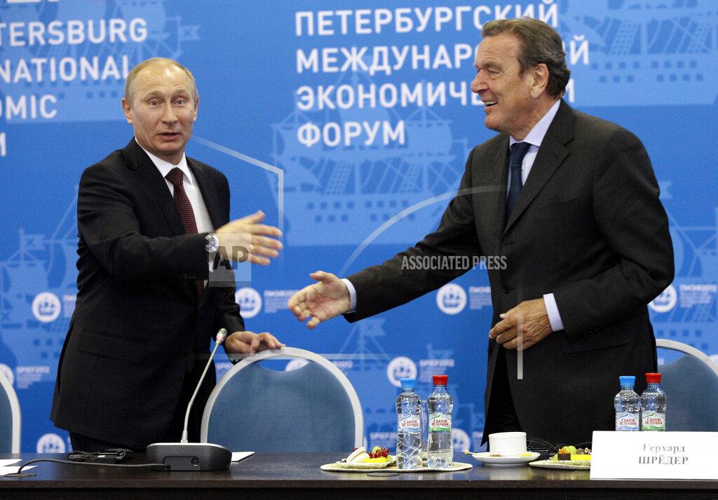 Dmitry Lovetsky Russian President Vladimir Putin, left, and Germany's former Chancellor Gerhard Schroeder attend an economic forum in St.Petersburg, Russia, Thursday, June 21, 2012. Gerhard Schroeder left the German chancellery after a narrow election defeat in 2005 with an ambitious overhaul of the country’s welfare state beginning to kick in and every chance of becoming a respected elder statesman. Fast-forward to last week: German lawmakers agreed to shut down Schroeder’s taxpayer-funded office, the European Parliament called for him to be sanctioned, and his own party set a mid-June hearing on applications to have him expelled. Schroeder’s association with the Russian energy sector turned the 78-year-old into a political pariah in Germany after the invasion of Ukraine. (AP Photo/Dmitry Lovetsky, pool)