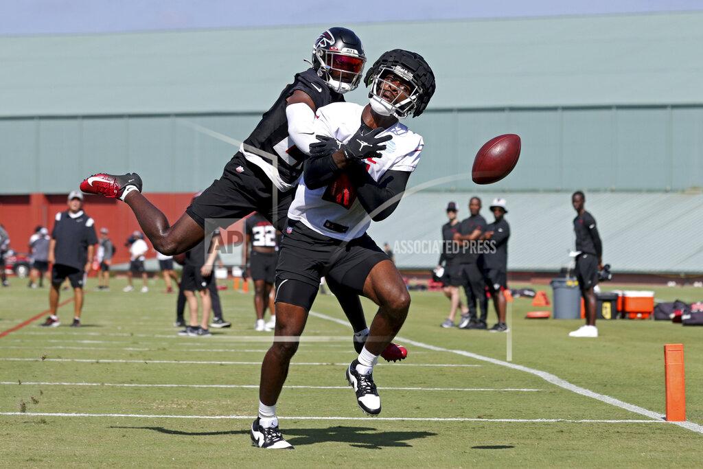 Jason Getz Atlanta Falcons safety Richie Grant (27), rear, breaks up a pass intended for tight end Kyle Pitts (8) during NFL football training camp in Flowery Branch, Ga., Friday, July 29, 2022. (Jason Getz/Atlanta Journal-Constitution via AP)