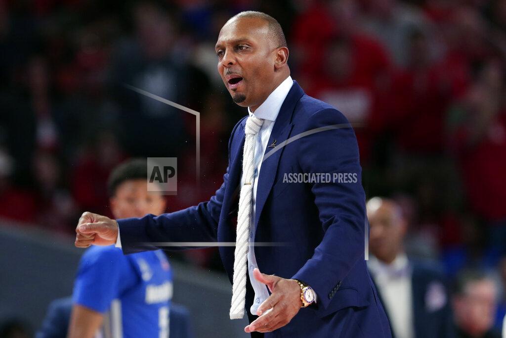 FILE - Memphis head coach Penny Hardaway questions a foul call during the second half of an NCAA college basketball game against Houston, Sunday, March 8, 2020, in Houston. As the NCAA gets set announce its plans for the 2020-21 college basketball season, there are clear precedents and blueprints in place should it decide to go the bubble route. “Maybe do it for maybe a week or two at a time, playing a certain amount of games and getting retested after you come back or something like that,” Memphis coach Penny Hardaway said. "It’s possible, it’s not going to be easy.”(AP Photo/Michael Wyke, File)