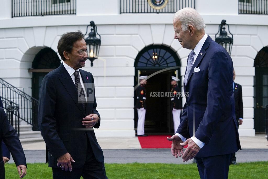 Susan Walsh President Joe Biden talks with the Sultan of Brunei Haji Hassanal Bolkiah as leaders from the Association of Southeast Asian Nations (ASEAN) gather for a group photo on the South Lawn of the White House in Washington, Thursday, May 12, 2022. (AP Photo/Susan Walsh)
