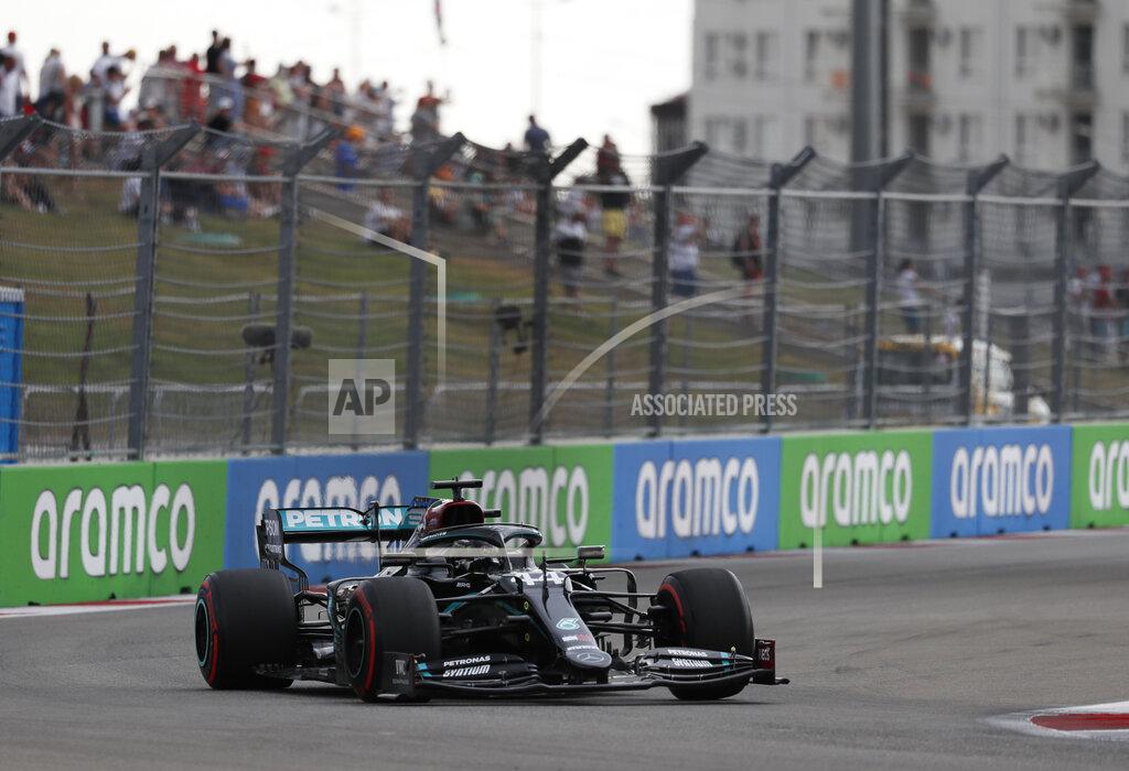 Yuri Kochetkov Mercedes driver Lewis Hamilton of Britain steers his car during the qualifying session for the upcoming Russian Formula One Grand Prix, at the Sochi Autodrom circuit, in Sochi, Russia, Saturday, Sept. 26, 2020. The Russian Formula One Grand Prix will take place on Sunday. (Yuri Kochetkov, Pool Photo via AP)