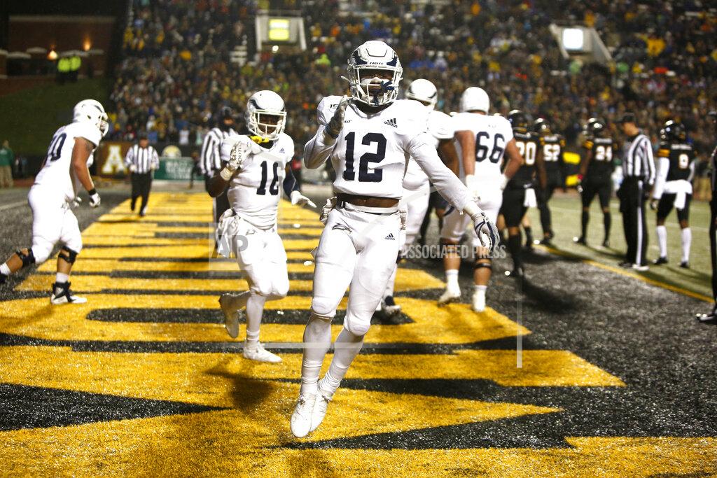 Brian Blanco Georgia Southern running back Wesley Kennedy III (12) celebrates his touchdown during the first half of the team's NCAA college football game against Appalachian State on Thursday, Oct. 31, 2019, in Boone, N.C. (AP Photo/Brian Blanco)