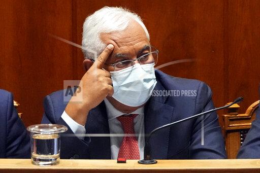Prime Minister Antonio Costa listens during a debate at the Portuguese Parliament before the voting of the government's state budget, in Lisbon, Wednesday, Oct. 27, 2021. Portugal's parliament is poised to reject the minority Socialist government's proposed state budget for 2022. That will likely trigger a snap election and put a brake on the country's post-pandemic recovery plans. (AP Photo/Armando Franca)