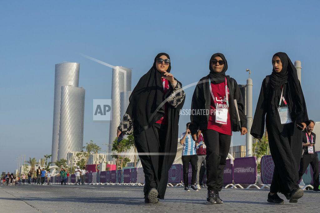Andre Penner People walk outside the Lusail stadium during a match between Saudi Arabia and Argentina in Lusail, Qatar, Tuesday, Nov. 22, 2022. (AP Photo/Andre Penner)