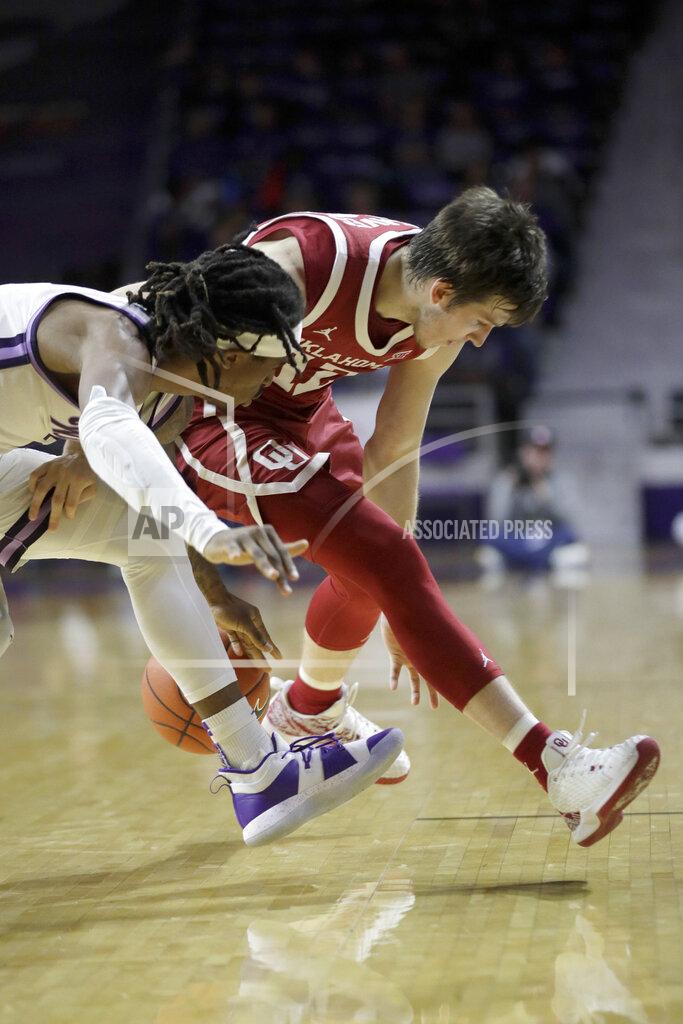 Orlin Wagner Oklahoma guard Austin Reaves (12) and Kansas State guard Cartier Diarra, left, compete for a loose ball during the second half of an NCAA college basketball game in Manhattan, Kan., Wednesday, Jan. 29, 2020. Kansas State won 61-53. (AP Photo/Orlin Wagner)