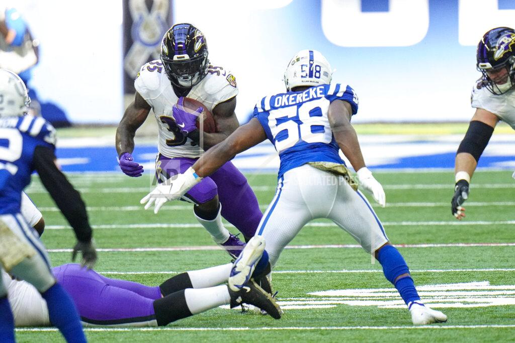 Aj Mast Baltimore Ravens running back Gus Edwards (35) cuts away from Indianapolis Colts inside linebacker Bobby Okereke (58) in the first half of an NFL football game in Indianapolis, Sunday, Nov. 8, 2020. (AP Photo/AJ Mast)
