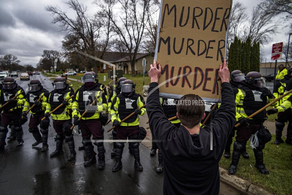 Richard Tsong-Taatarii Protesters confronted police over the shooting death of Daunte Wright at a rally at the Brooklyn Center Police Department in Brooklyn Center, Minn., Monday, April 12, 20121. (Richard Tsong-Taatarii/Star Tribune via AP)