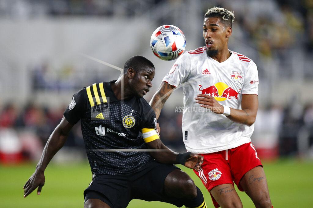 Jay Laprete Columbus Crew's Jonathan Mensah, left, tries to head the ball away from New York Red Bulls' Fabio during the first half of an MLS soccer match Saturday, Oct. 23, 2021, in Columbus, Ohio. (AP Photo/Jay LaPrete)
