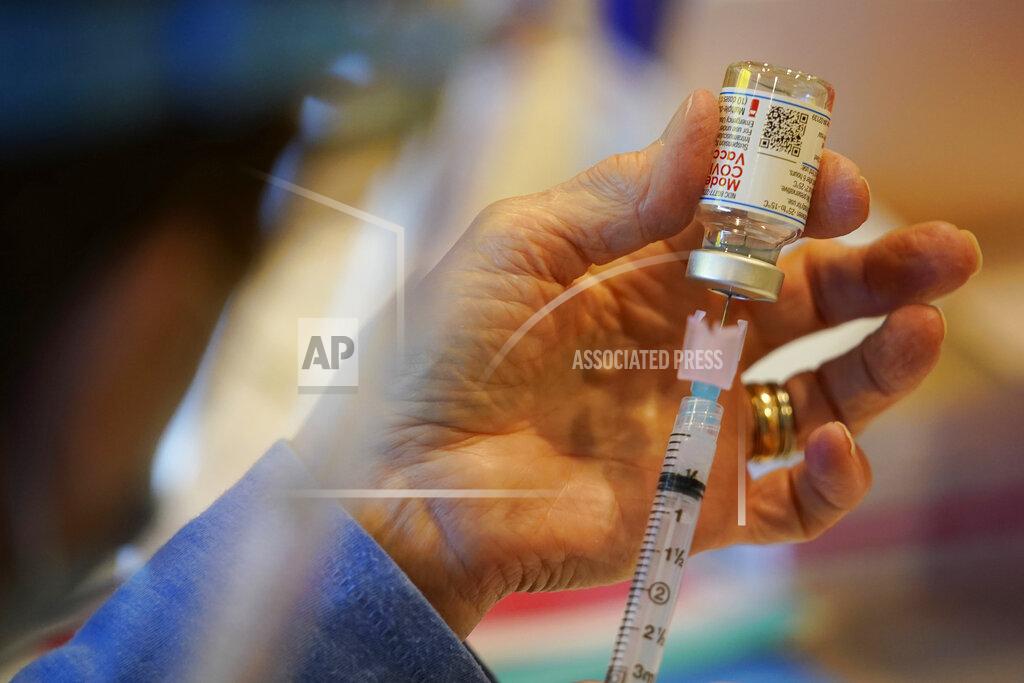 Matt Slocum FILE - In this Dec. 29, 2020, file photo, Pat Moore, with the Chester County, Pa., Health Department, fills a syringe with Moderna COVID-19 vaccine before administering it to emergency medical workers and health care personnel at the Chester County Government Services Center in West Chester, Pa. On Friday, May 21, The Associated Press reported on stories circulating online incorrectly claiming SM-102 is an ingredient in the Moderna vaccine that is not safe for humans or veterinary use. (AP Photo/Matt Slocum, File)