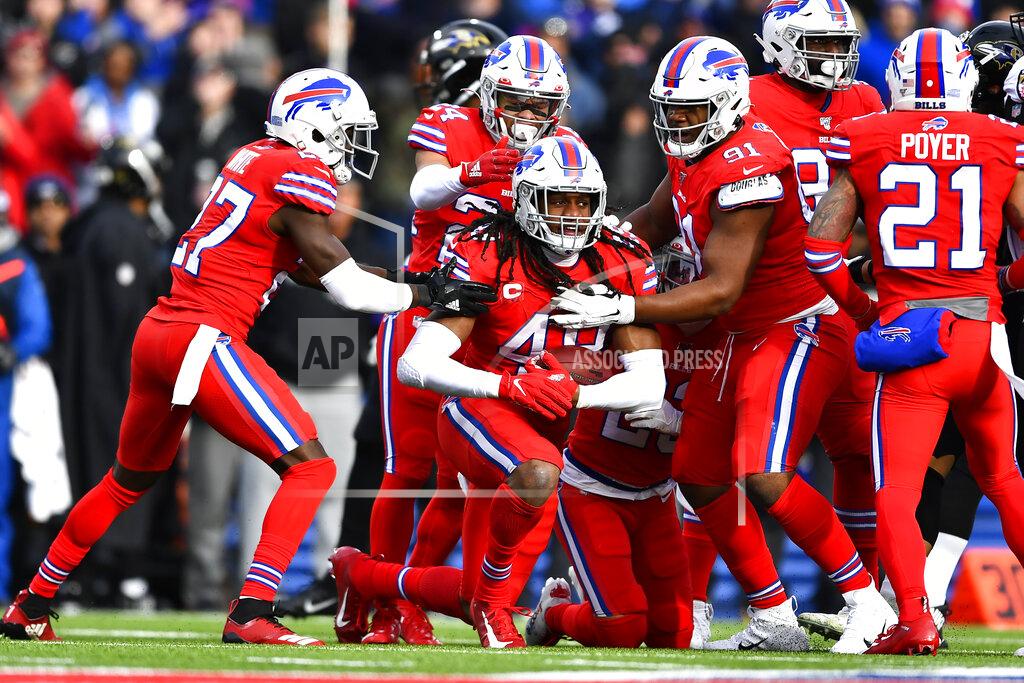 Adrian Kraus Buffalo Bills middle linebacker Tremaine Edmunds, center, celebrates after intercepting a pass by Baltimore Ravens quarterback Lamar Jackson (8) during the first half of an NFL football game in Orchard Park, N.Y., Sunday, Dec. 8, 2019. (AP Photo/Adrian Kraus)