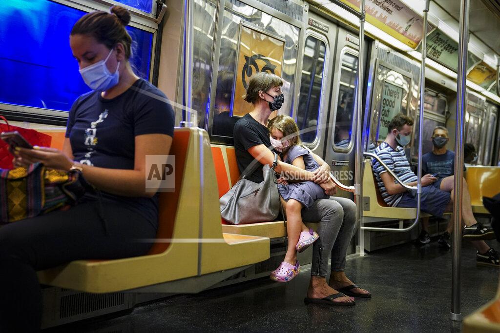 John Minchillo FILE - In this Aug. 17, 2020, file photo, passengers ride the New York City subway. Subway ridership, which numbers several million people daily during normal times, has failed to get above 30% of pre-pandemic levels. (AP Photo/John Minchillo, File)