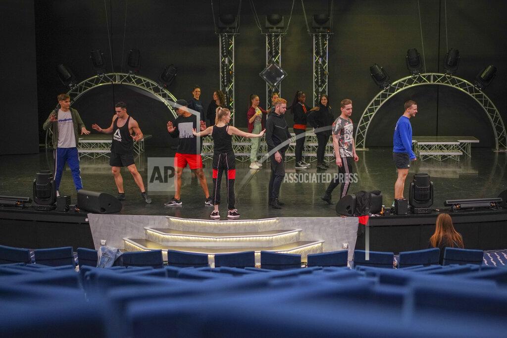Andrew Medichini Dancers and actors practice in the theater of the MSC Grandiosa cruise ship in Civitavecchia, near Rome, Wednesday, March 31, 2021. MSC Grandiosa, the world's only cruise ship to be operating at the moment, left from Genoa on March 30 and stopped in Civitavecchia near Rome to pick up more passengers and then sail toward Naples, Cagliari, and Malta to be back in Genoa on April 6. For most of the winter, the MSC Grandiosa has been a lonely flag-bearer of the global cruise industry stalled by the pandemic, plying the Mediterranean Sea with seven-night cruises along Italy’s western coast, its major islands and a stop in Malta. (AP Photo/Andrew Medichini)