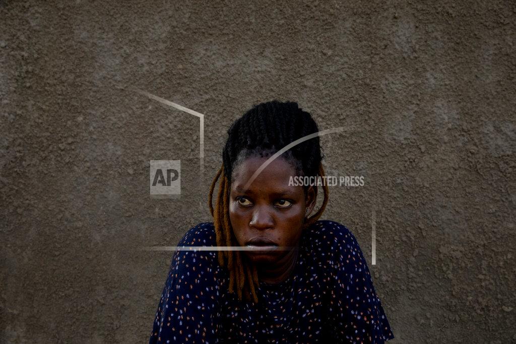 Adrienne Surprenant Paska Itwari Beda, the young mother of five children, sits at her Juba, South Sudan home, Saturday, May 29, 2021. Even before the pandemic hit, South Sudanese women were accustomed to building lives on the edge of uncertainty. But COVID-19 is shaking that fragile foundation. The country is just a decade old and one of the world's most difficult places to raise children. (AP Photo/Adrienne Surprenant)