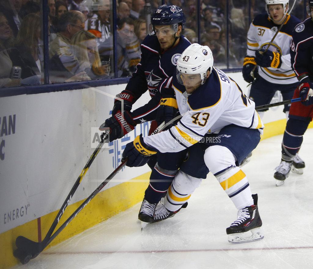 Jay Laprete Columbus Blue Jackets' Alexander Wennberg, left, of Sweden, and Buffalo Sabres' Conor Sheary fight for the puck during the third period of an NHL hockey game Saturday, Oct. 27, 2018, in Columbus, Ohio. (AP Photo/Jay LaPrete)