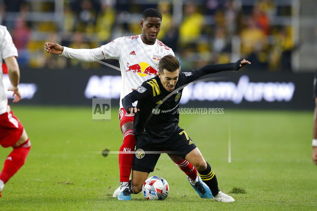 Jay Laprete New York Red Bulls' Andres Reyes, top, pushes Columbus Crew's Pedro Santos to the ground during the first half of an MLS soccer match Saturday, Oct. 23, 2021, in Columbus, Ohio. (AP Photo/Jay LaPrete)