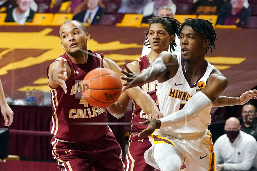 Jim Mone Minnesota's Marcus Carr, right, gets off a pass as Boston College's Steffon Mitchell defends during the first half of an NCAA college basketball game Tuesday, Dec. 8, 2020, in Minneapolis. (AP Photo/Jim Mone)