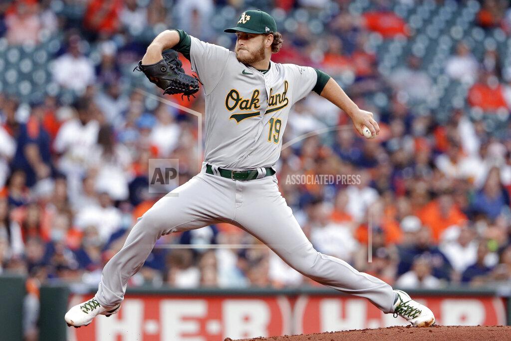 Michael Wyke Oakland Athletics starting pitcher Cole Irvin winds up during the first inning of the team's baseball game against the Houston Astros on Thursday, April 8, 2021, in Houston. (AP Photo/Michael Wyke)