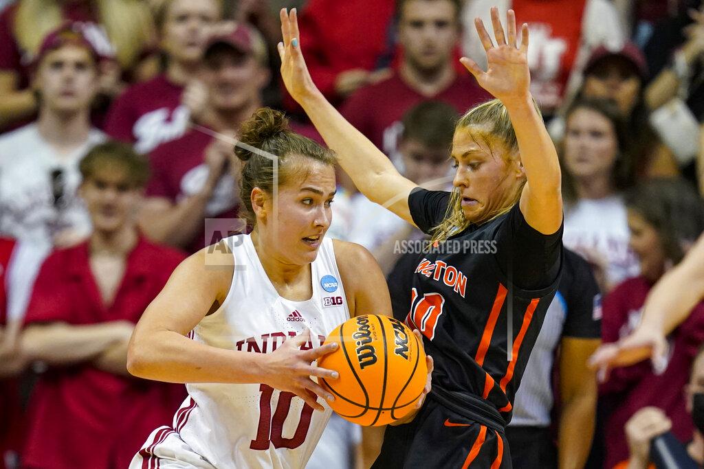 Michael Conroy Indiana forward Aleksa Gulbe (10) drives on Princeton forward Ellie Mitchell (00) in the first half of a college basketball game in the second round of the NCAA tournament in Bloomington, Ind., Monday, March 21, 2022. (AP Photo/Michael Conroy)